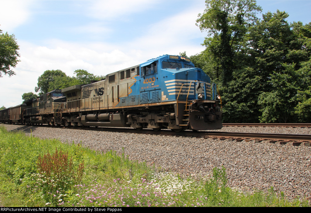 NS 4000 takes train 590 East, with loaded coal hoppers